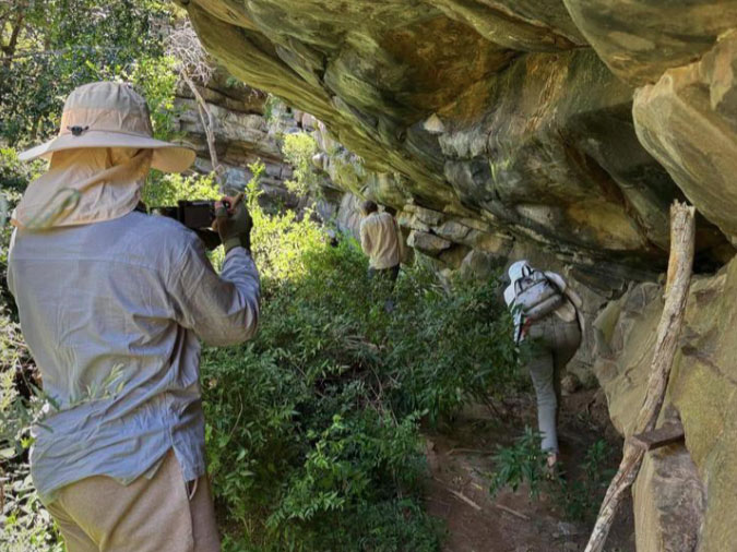 Researchers exploring ancient San rock shelters and archaeological sites